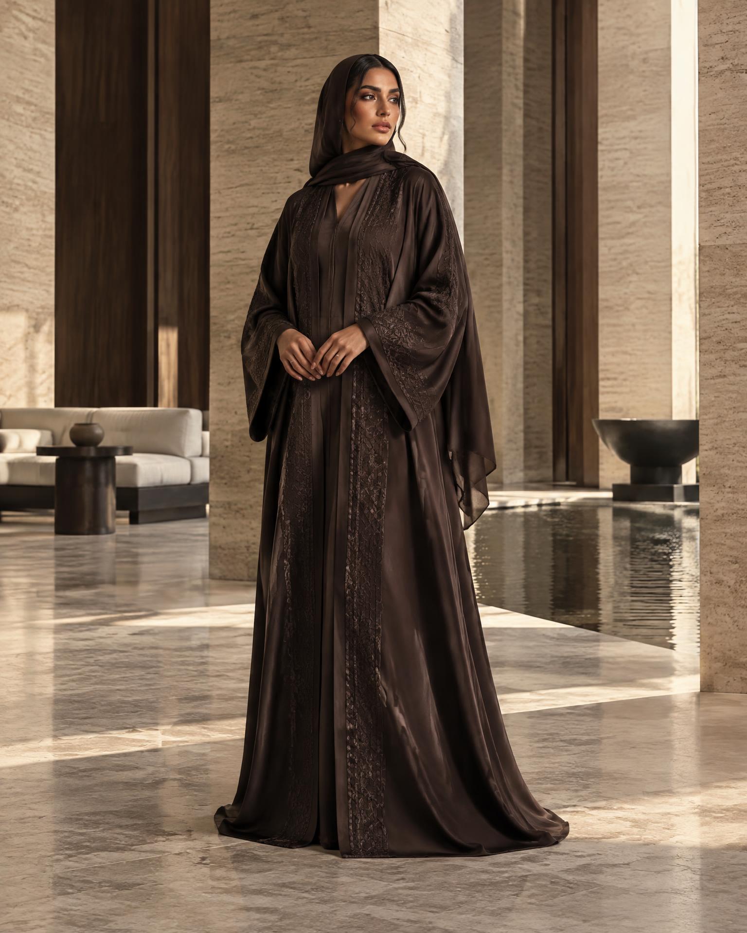 Woman wearing a deep espresso SADURRA caftan